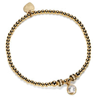 Gold-filled beaded bracelet with a cubic zirconia charm, representing an April birthstone.