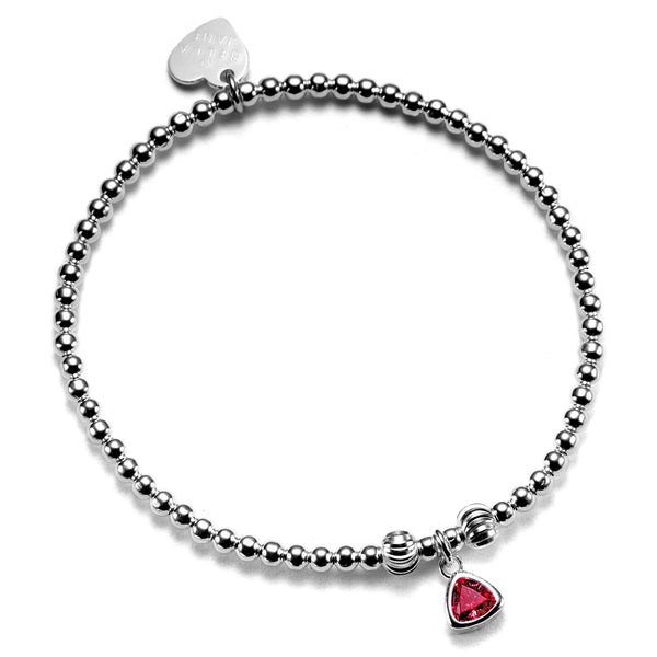 A close up of a handmade beaded bracelet featuring a garnet coloured birthstone charm to represent January