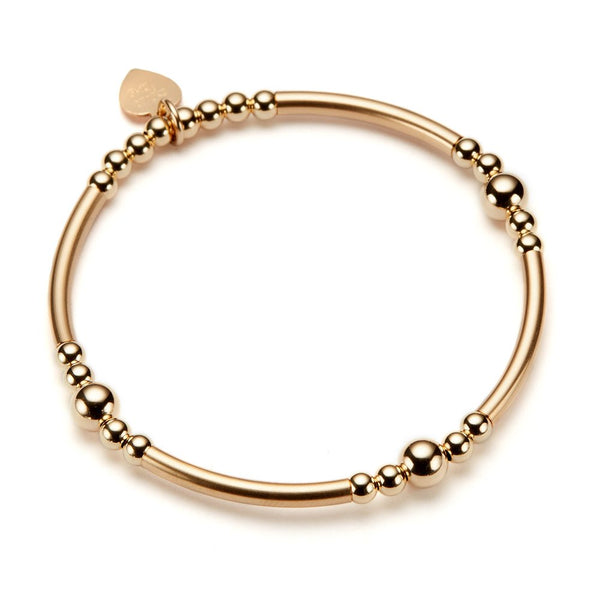 Gold-filled beaded stacking bracelet on a white background