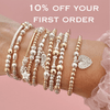 Stack of gold and silver beaded bracelets on a wrist with promotional text on a pink background