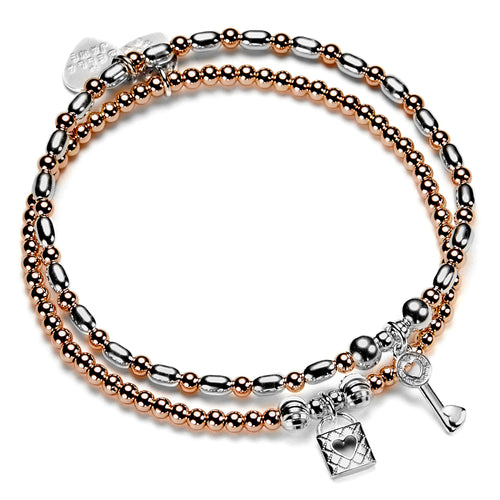 rose gold and sterling silver beaded stacking bracelet duo with sterling silver padlock and key charms