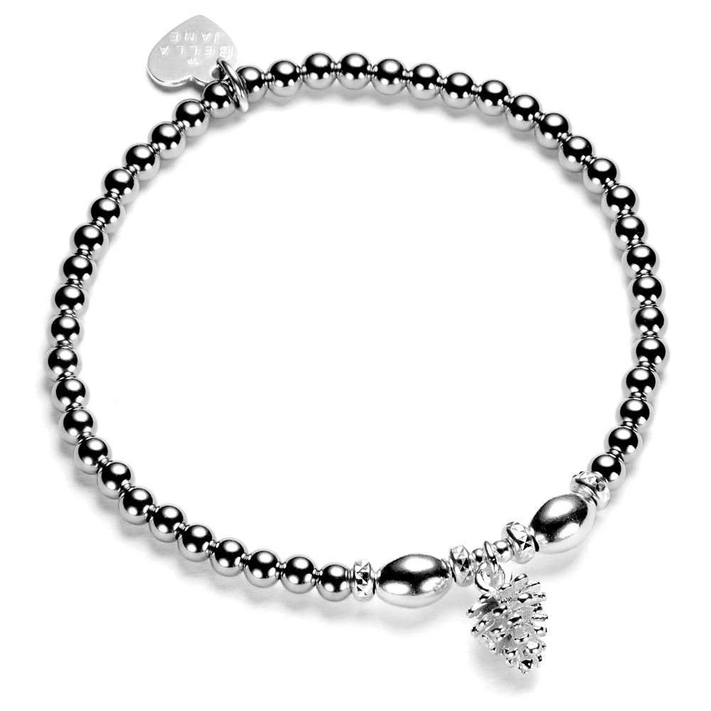 A sterling silver bracelet featuring a series of round and oval beads, a pine cone charm, and a heart-shaped tag, against a white background.