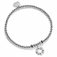 A Bella Jane silver beaded bracelet on a white background, featuring a silver wreath-shaped charm with alternate little hearts and roses