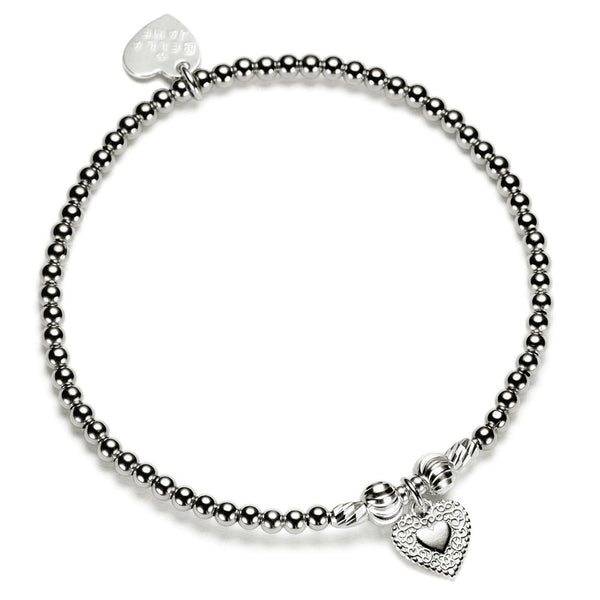 Silver beaded bracelet with heart-shaped charm on a white background