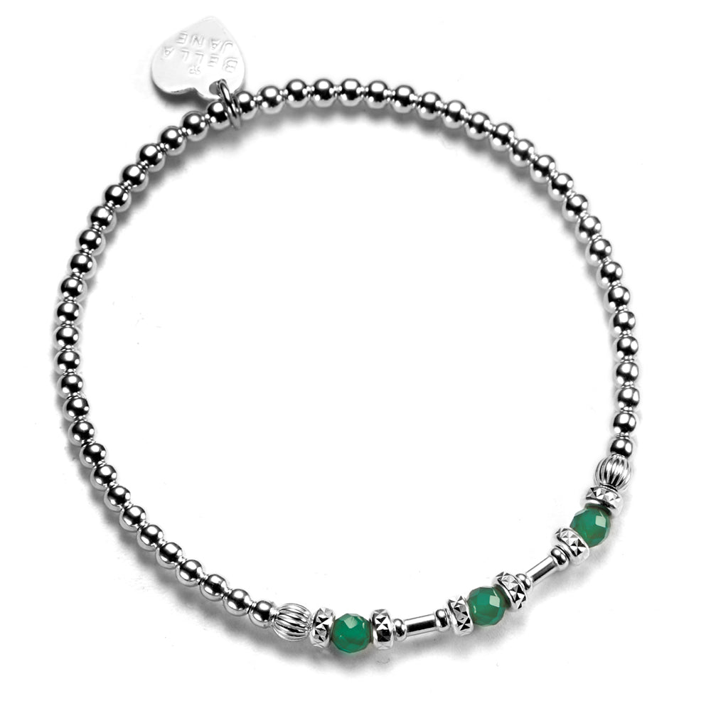 A sterling silver bracelet with green onyx beads and a silver Bella Jane heart tag.