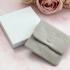 A close up of the Bella Jane branded jewellery pouch and and box