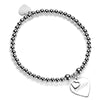 Silver beaded bracelet with a heart-shaped charm featuring the word Bestie on a white background