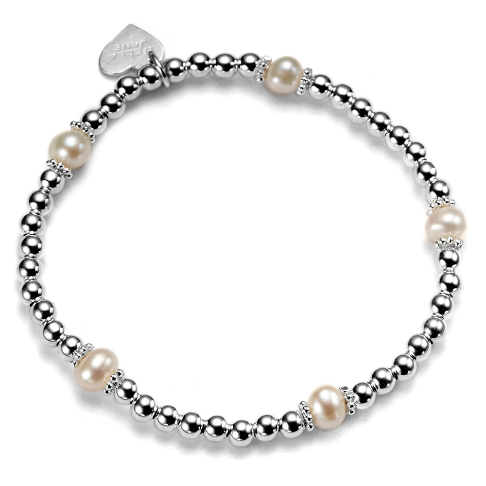 Silver and freshwater pearl beaded bracelet against a white background