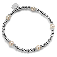Silver and freshwater pearl beaded bracelet against a white background