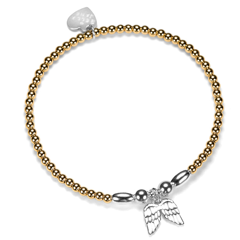 A gold-filled beaded stacking bracelet, featuring sterling silver focal beads and a sterling silver angel wings charm, shown on a plain white background.