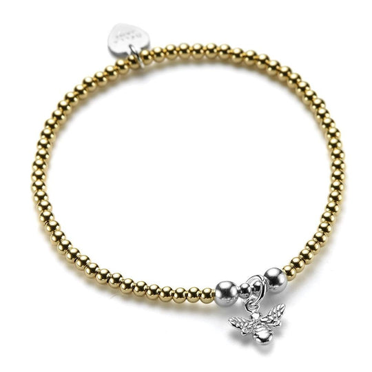 A gold beaded bracelet with a silver bee charm.