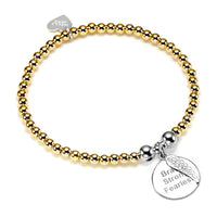 A gold beaded bracelet with a round silver disc charm with the words Brave, Strong, Fearless engraved on the front, with a tiny angel wing sitting on top of the disc, against a white background.