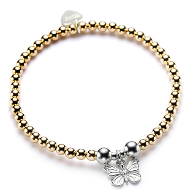 A gold beaded bracelet with a silver butterfly charm.