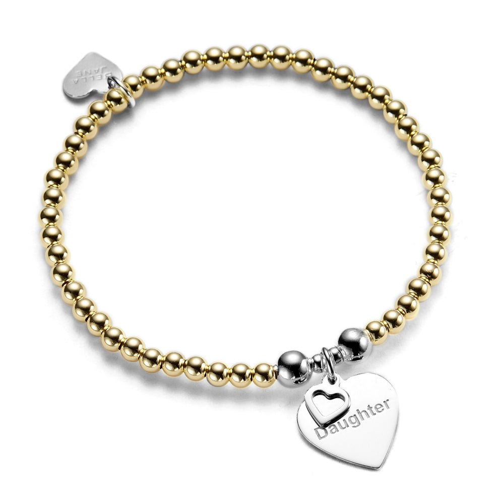 A bracelet with gold beads and a silver heart-shaped charm with the word 'Daughter' engraved on it.