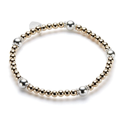 Bracelet with gold and silver beads on a white background