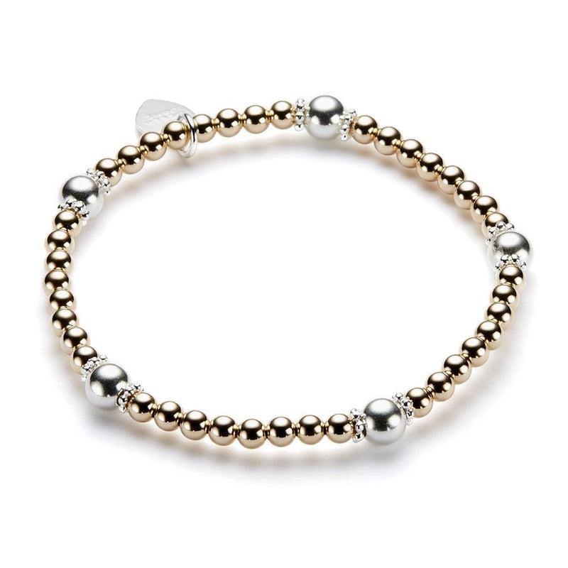 Bracelet with gold and silver beads on a white background