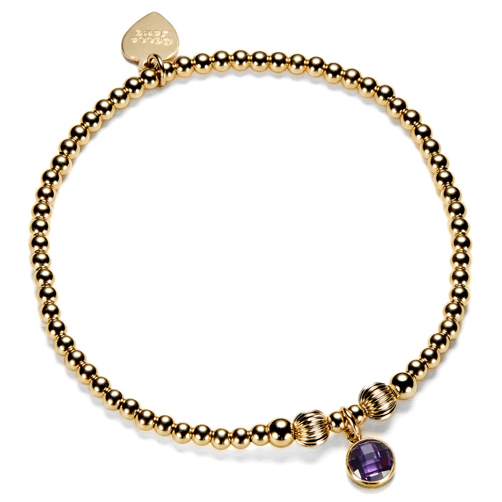 Gold-filled beaded bracelet with a purple cubic zirconia charm, representing a February birthstone.