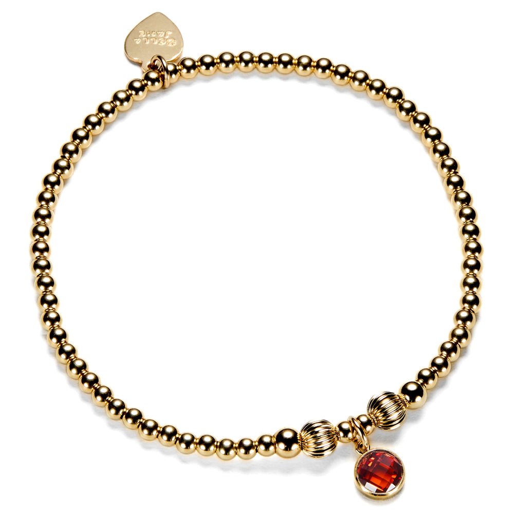 Gold-filled beaded bracelet with a red cubic zirconia charm, representing a July birthstone.
