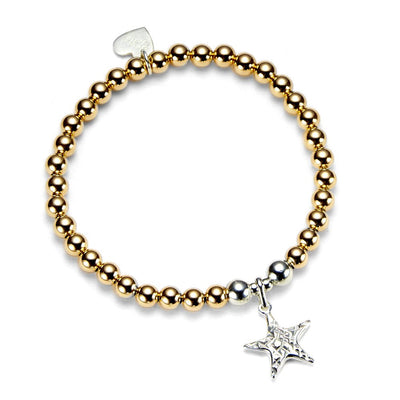 Gold beaded bracelet with a silver star charm on a white background