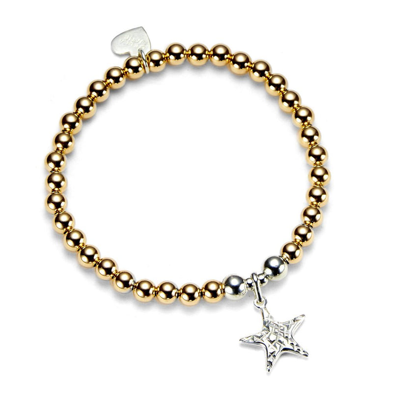 Gold beaded bracelet with a silver star charm on a white background