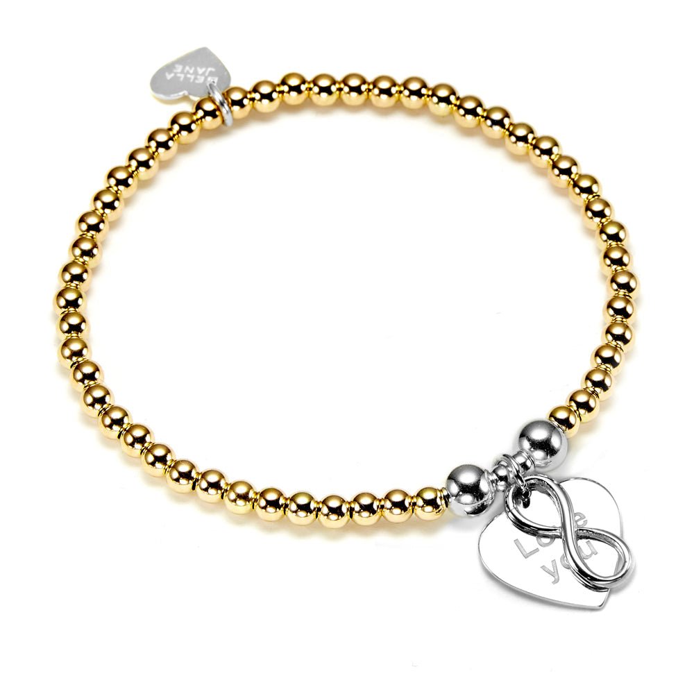 Gold beaded bracelet with silver love you charm on a white background
