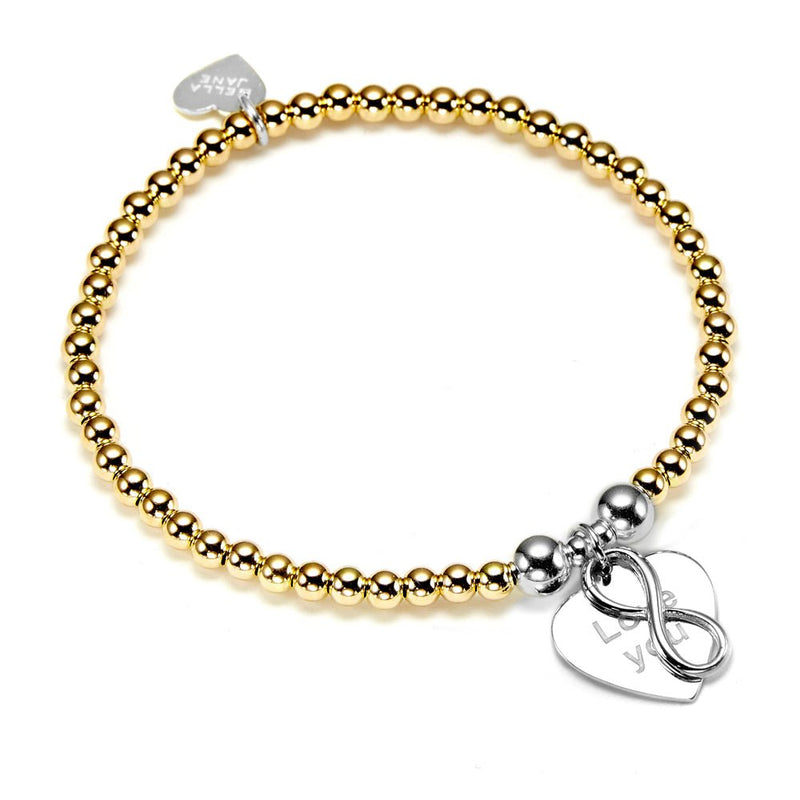 Gold beaded bracelet with silver love you charm on a white background