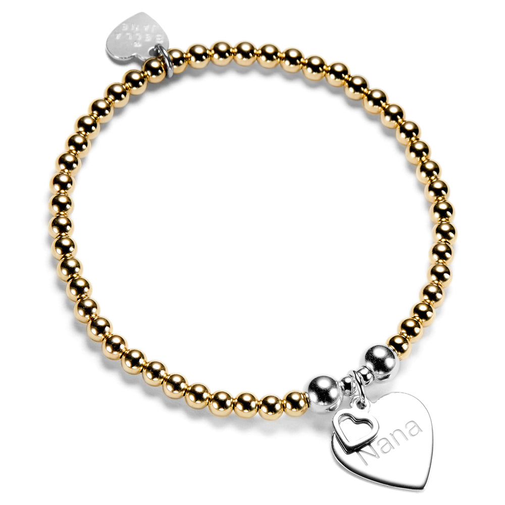 Gold beaded bracelet with silver heart-shaped charm featuring the word 'Nana' on a white background