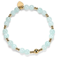 Bracelet with light blue beads and gold accents on a white background