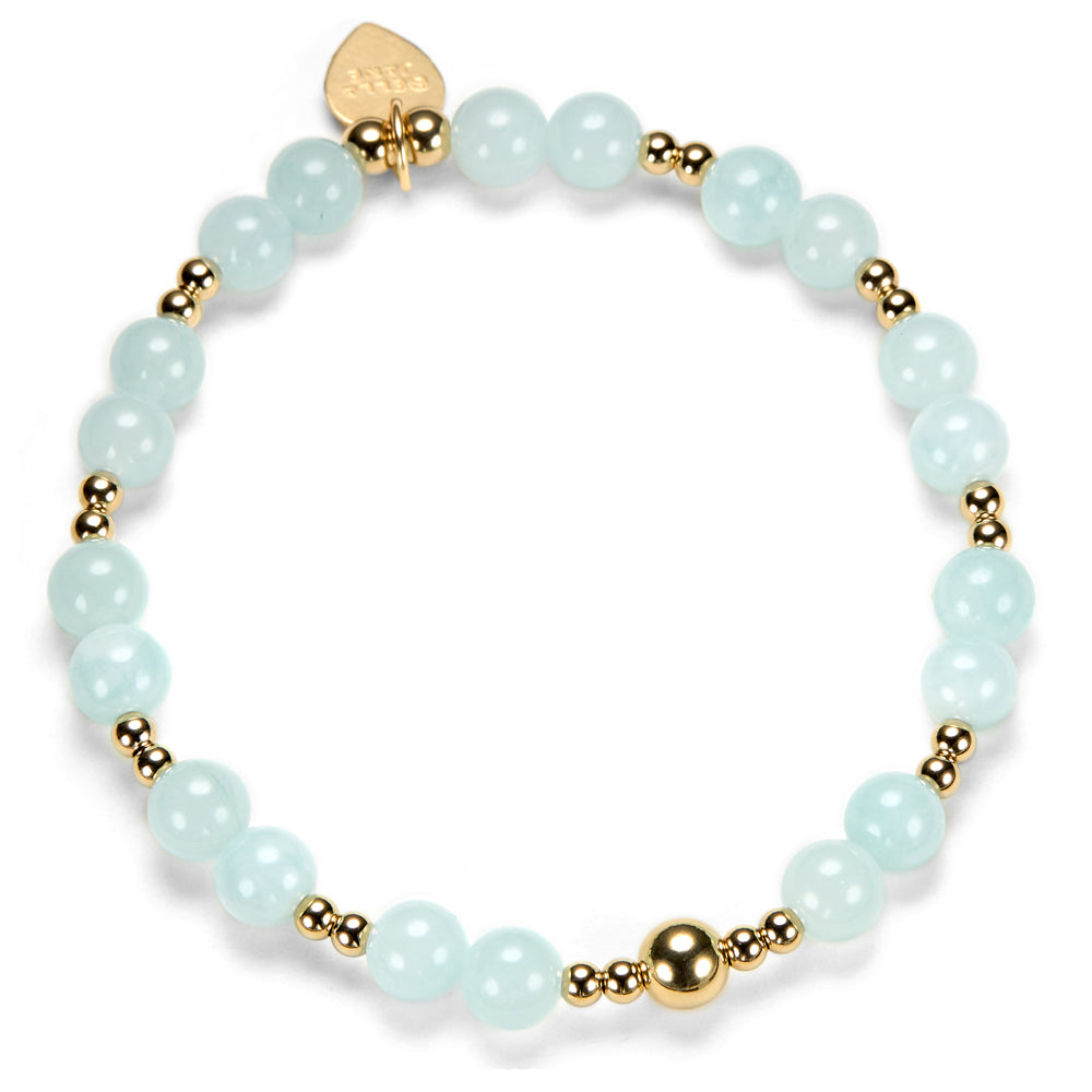 Bracelet with light blue beads and gold accents on a white background