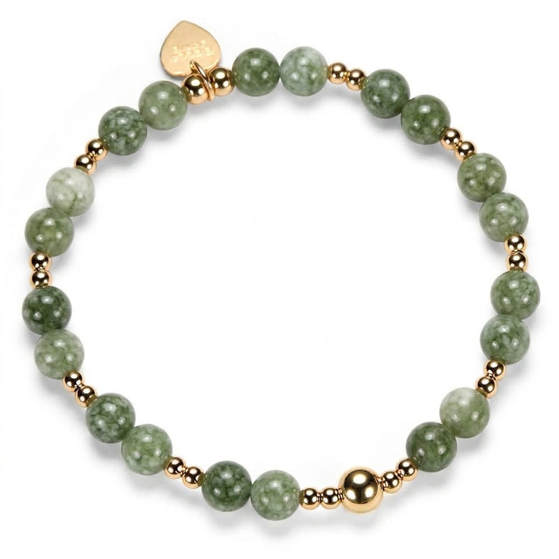 A beaded bracelet featuring round green marbled beads, small gold-filled beads, a gold Bella Jane heart tag, displayed on a clean white background.