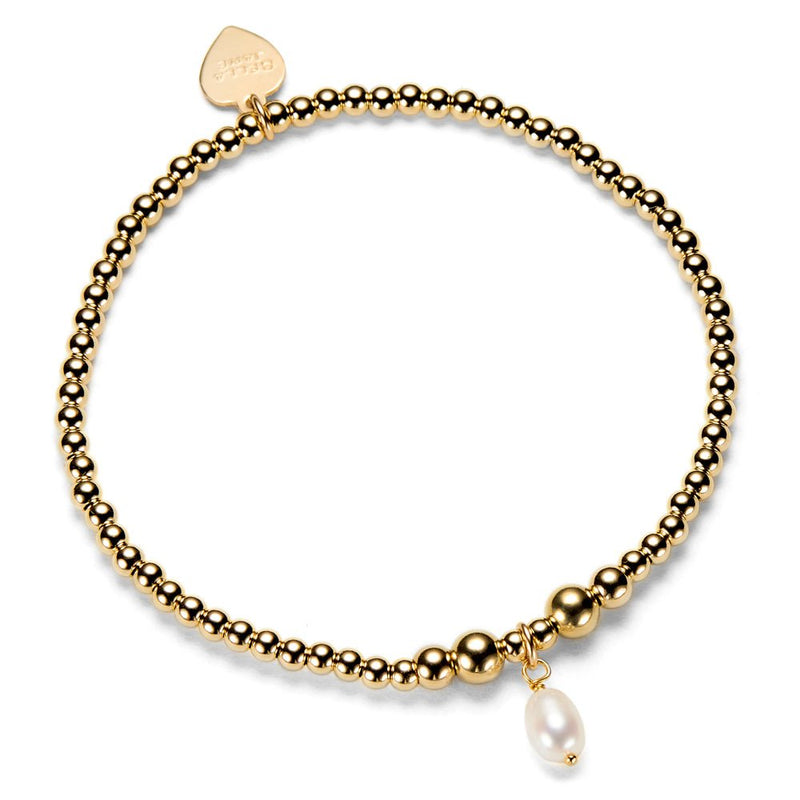 Gold beaded bracelet with a pearl charm on a white background