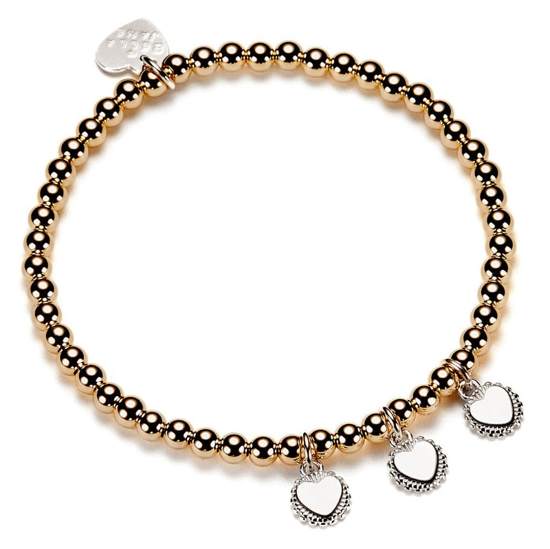 Gold beaded bracelet with heart-shaped disc charms for engraving initials, on a white background