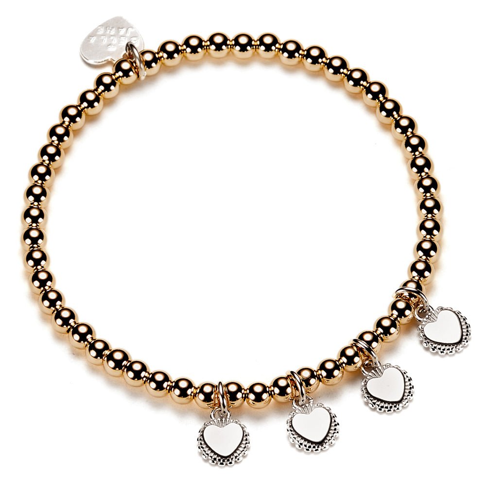 Gold beaded bracelet with heart-shaped charms for engraving initials, on a white background