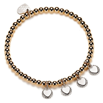 Gold beaded bracelet with heart-shaped charms for engraving initials, on a white background