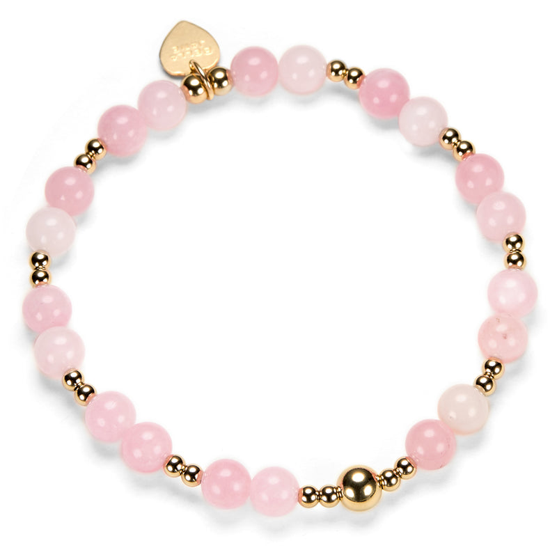 Pink beaded bracelet with gold accents on a white background
