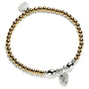A gold-filled and sterling silver bracelet featuring a series of round and oval beads, a silver pine cone charm, and a heart-shaped tag, against a white background.
