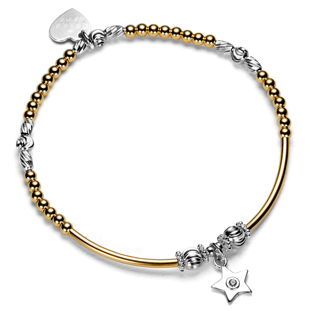 A gold-filled and sterling silver beaded bracelet, featuring, a silver star charm with tiny cubic zirconia stone in the centre and a heart tag, against a white background.