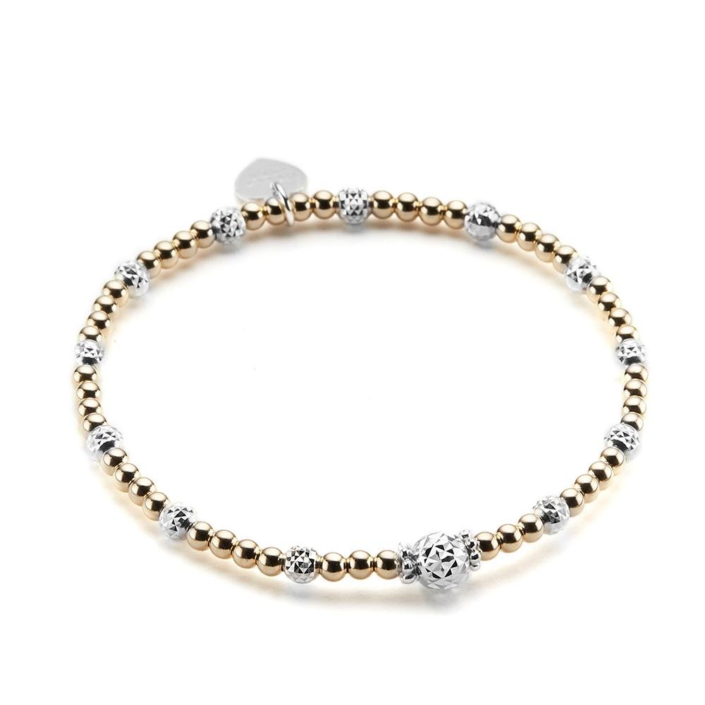 A gold and sterling silver mixed-metal stacking bracelet, featuring a focal silver faceted focal bead at the front and a branded Bella Jane heart tag at the back, displayed on a white background.