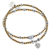 Two gold and silver mixed metal beaded stacking bracelets, one with a sparkly heart-shaped charm on a white background.