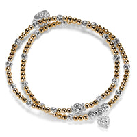 2 gold-filled beaded Bella Jane stacking bracelets, featuring sparkly sterling silver faceted beads, with one bracelet featuring a sterling silver and cubic zirconia sparkly heart charm, against a white background.