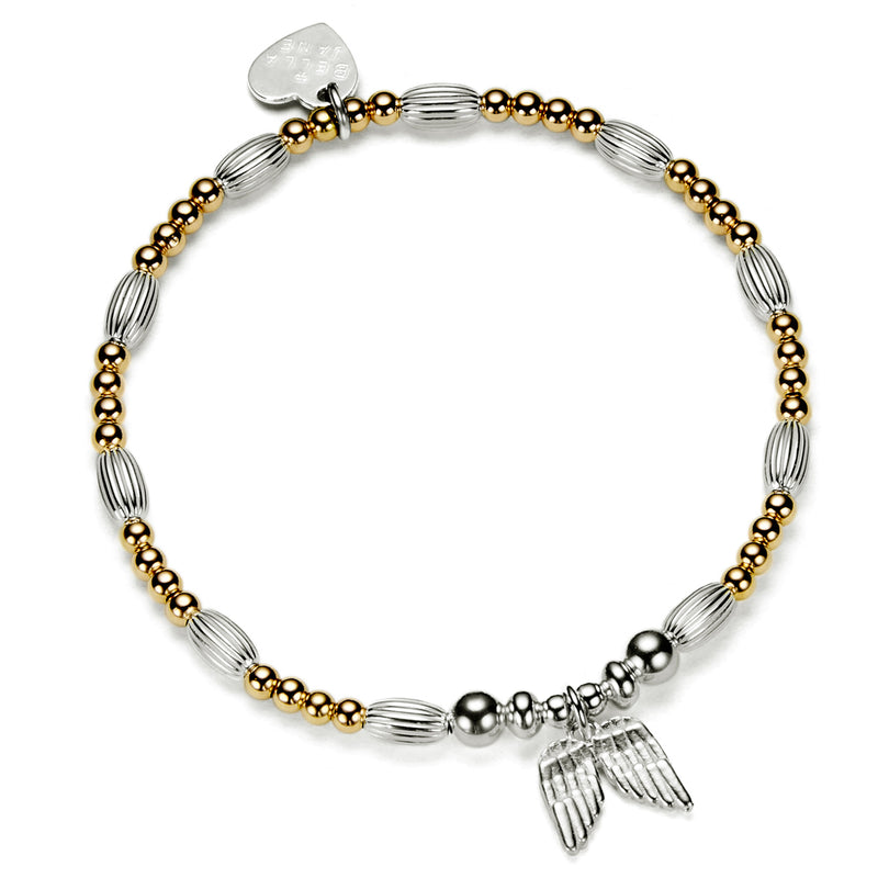 Gold and silver beaded bracelet with angel wings charm, against a white background