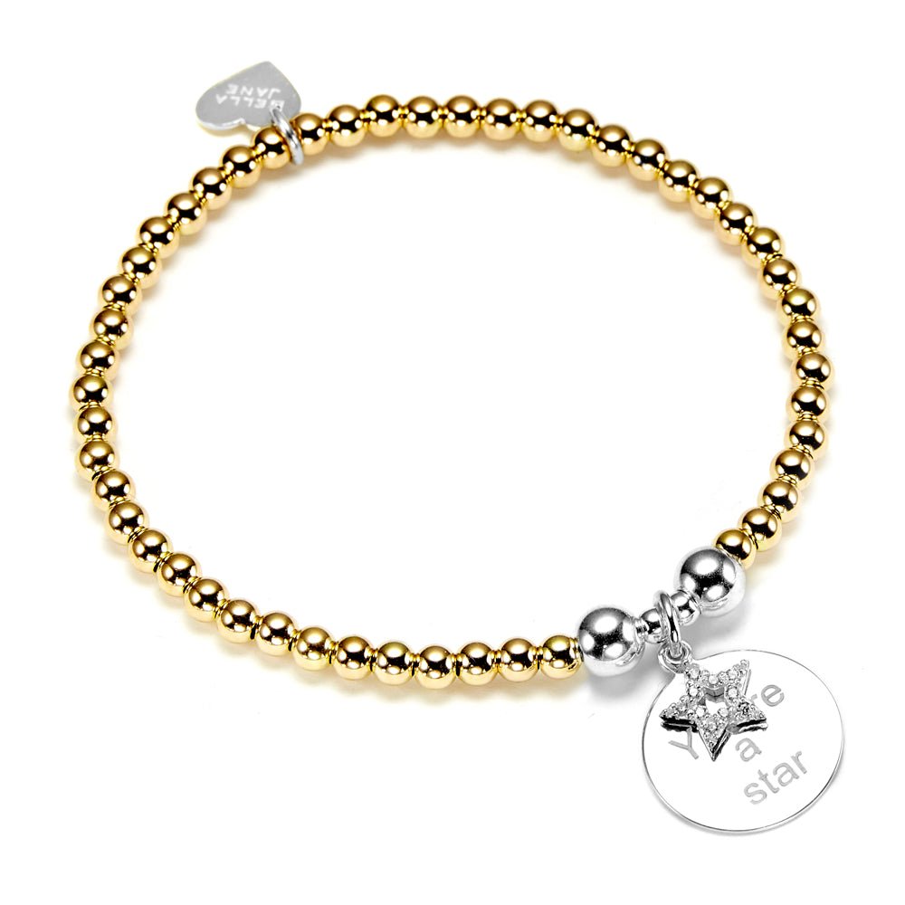 Gold beaded bracelet with a silver disc charm and sparkly silver star, with the words 'You're a star' engraved, on a white background