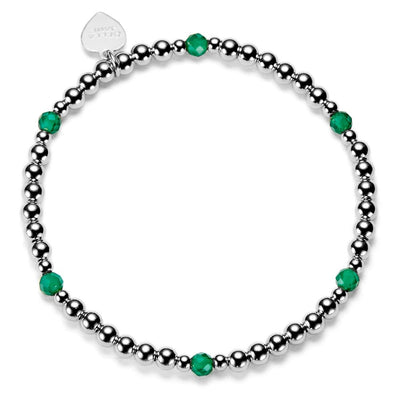 Sterling silver beaded bracelet with green beads and on a white background