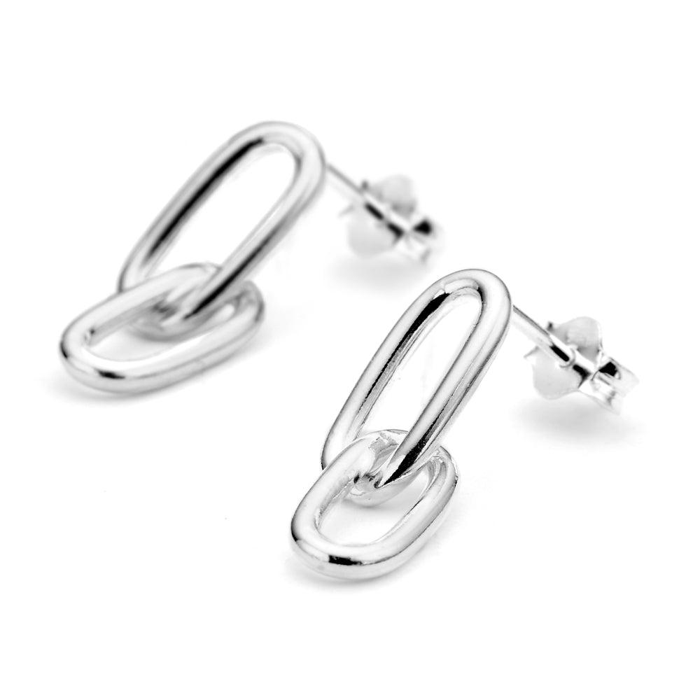 Links chain earrings against a white background