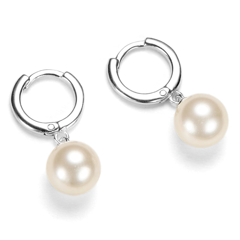 A pair of sterling silver huggie hoop earrings with Swarovski pearl drops, displayed on a white background.