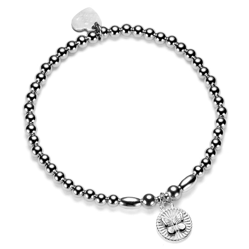 Silver beaded bracelet with a round butterfly disc charm on a white background