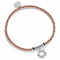 A Bella Jane rose gold-filled and sterling silver beaded bracelet on a white background, featuring a silver wreath-shaped charm with alternate little hearts and roses