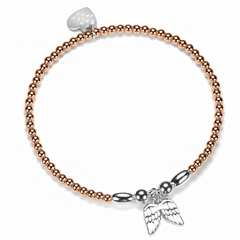 A rose gold-filled beaded stacking bracelet, featuring sterling silver focal beads and a sterling silver angel wings charm, shown on a plain white background.