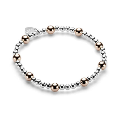 Beaded bracelet with silver and rose gold beads on a white background