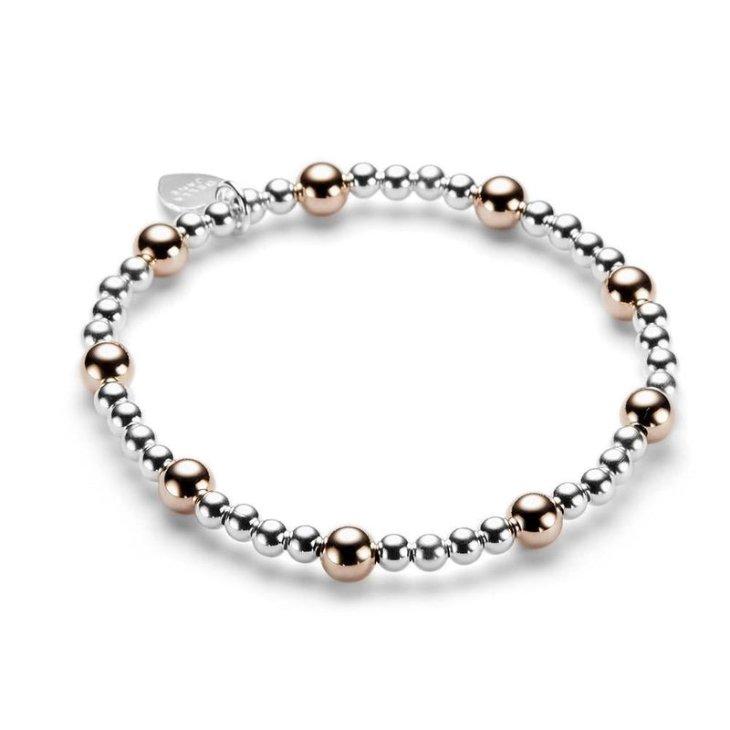 Beaded bracelet with silver and rose gold beads on a white background